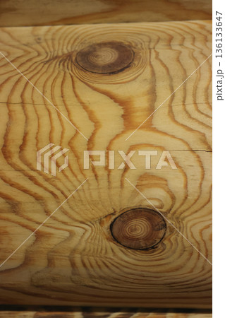 Fragment of a log cabin. Longitudinal seam between logs. View from inside the room. Close-up. 136133647