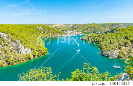 Higway over the Krka river, Croatia. View from famous bridge near the Sibenik and Skradin city. River with boat and yacht. 136133857