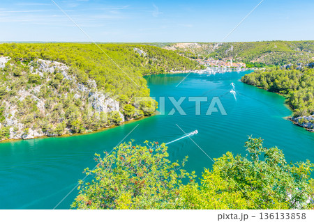 Higway over the Krka river, Croatia. View from famous bridge near the Sibenik and Skradin city. River with boat and yacht. 136133858