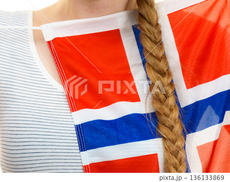 Young woman holding norwegian flag Young woman holding norwegian flag 136133869
