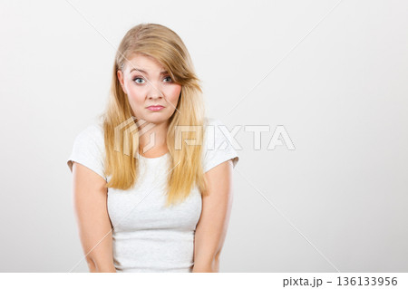 Sad cute young blonde attractive woman Sad cute young blonde attractive woman 136133956
