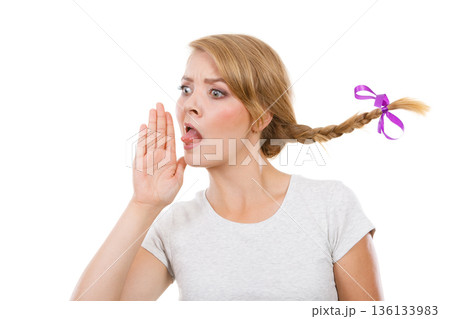 Teenage girl in braid hair talking rumors Teenage girl in braid hair talking rumors 136133983