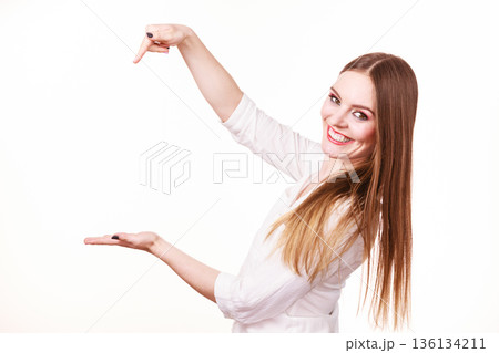 Woman holds empty hand copy space for product 136134211