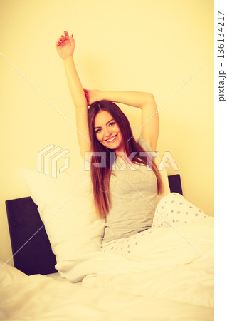 Attractive woman in the bed. 136134217