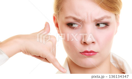 Phone. Angry businesswoman making call me gesture 136134347