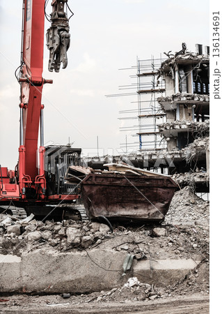 Building demolition by machinery for new construction. Building demolition by machinery for new construction. 136134691