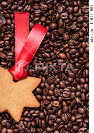 star shaped christmas cookies on coffee beans 136134698