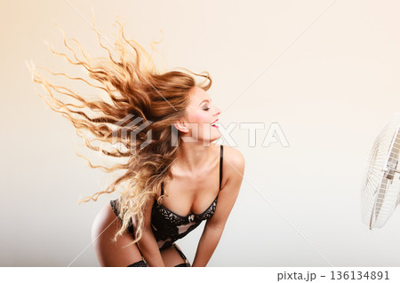 Woman with wind in hair 136134891