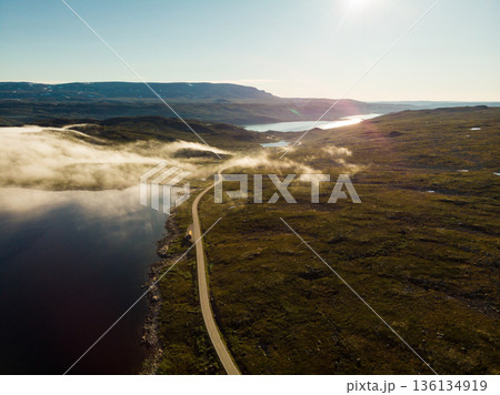 Road crossing Hardangervidda plateau, Norway. Aerial view. 136134919