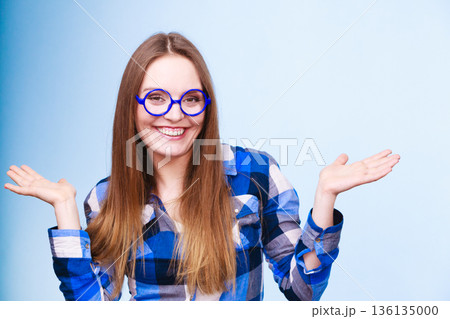 Happy smiling nerdy woman in weird glasses 136135000
