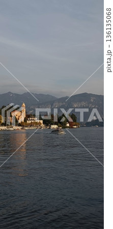 TREMEZZO, ITALY - Lake Como on a cloudy spring evening. TREMEZZO, ITALY - Lake Como on a cloudy spring evening. 136135068