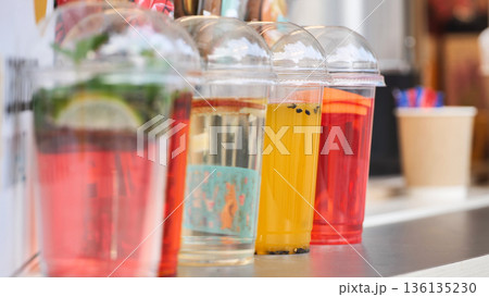 Refreshing summer drinks serving at outdoor bar 136135230