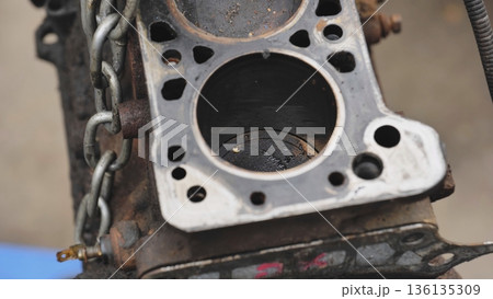 Car engine cylinder block during repair service 136135309