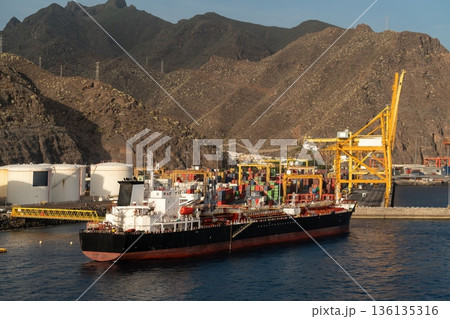 Cargo ship at container terminal in Santa Cruz de Tenerife port, Spain 136135316