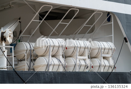 Liferaft canisters secured on ship deck, maritime safety equipment 136135324