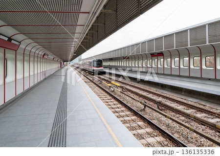 Vienna metro platform with modern train and long perspective 136135336
