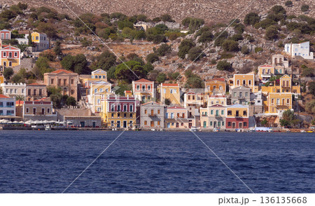 Colorful houses on hillside in Symi island Greece Colorful houses on hillside in Symi island Greece 136135668