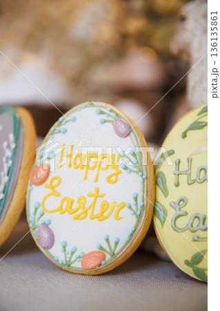 Close up of Happy Easter iced cookie with pastel spring decoration 136135861