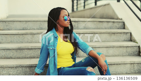 stylish young african woman posing in the city stylish young african woman posing in the city 136136509