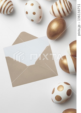 Easter greeting card with gold decorated eggs and envelope 136138751
