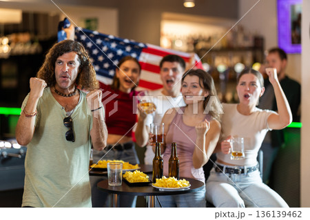Group of fans in bar with US flag 136139462
