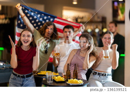 Group of fans in bar with US flag Group of fans in bar with US flag 136139521