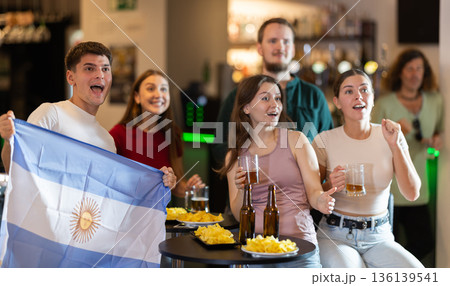 Group of fans in bar with Argentina flag 136139541