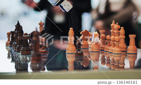 Robotic arm playing chess, demonstrating artificial intelligence and strategic thinking Robotic arm playing chess, demonstrating artificial intelligence and strategic thinking 136140181