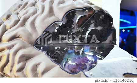 Brain model displaying gears and mechanics, representing intelligence and AI at exhibition Brain model displaying gears and mechanics, representing intelligence and AI at exhibition 136140216