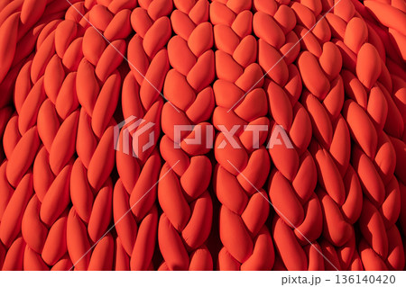 Braided chunky knit pattern creating a warm cozy vibrant textile surface 136140420