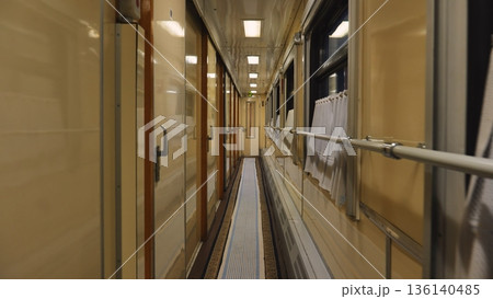 Train carriage corridor interior at night, long journey transportation and travel 136140485