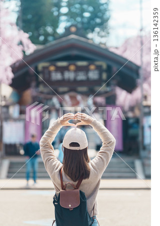 Woman tourist sightseeing Sakurayama Shrine with Cherry blossom in Spring season, happy traveler travel in Morioka city, Iwate prefecture, Japan. famous Landmark Travel and Vacation destination Woman tourist sightseeing Sakurayama Shrine with Cherry blossom in Spring season, happy traveler travel in Morioka city, Iwate prefecture, Japan. famous Landmark Travel and Vacation destination 136142359
