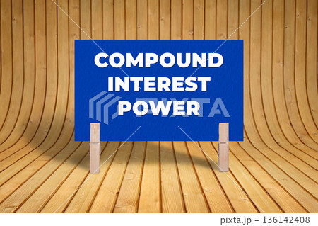 Concept words Compound Interest Power, Dark Blue Texture Rectangle Card Held By Clothespin Wooden Texture Background, Business and Compound Interest Power Theme Concept words Compound Interest Power, Dark Blue Texture Rectangle Card Held By Clothespin Wooden Texture Background, Business and Compound Interest Power Theme 136142408