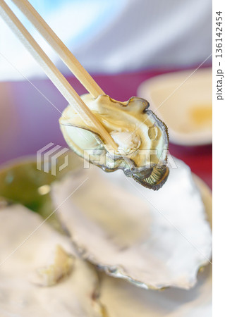 grilled Oyster in Matsushima fish market, seafood famous and popular of Matsushima bay in Miyagi Prefecture, Tohoku, Japan grilled Oyster in Matsushima fish market, seafood famous and popular of Matsushima bay in Miyagi Prefecture, Tohoku, Japan 136142454