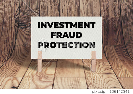 Concept words Investment Fraud Protection, White Concrete Texture Rectangle Card Held By Clothespin Wooden Texture Background, Business and Investment Fraud Protection Theme Concept words Investment Fraud Protection, White Concrete Texture Rectangle Card Held By Clothespin Wooden Texture Background, Business and Investment Fraud Protection Theme 136142541