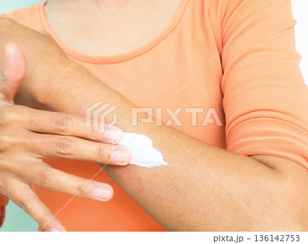Woman Apply Lotion Skin Cream Moisture Body Care on Hand, Facial Mask Serum Medicine Injury Natural Skin Care Treatment Herb Cosmetic Sunscreen Protection, Asian Girl Black Hair and Skin tan. Woman Apply Lotion Skin Cream Moisture Body Care on Hand, Facial Mask Serum Medicine Injury Natural Skin Care Treatment Herb Cosmetic Sunscreen Protection, Asian Girl Black Hair and Skin tan. 136142753