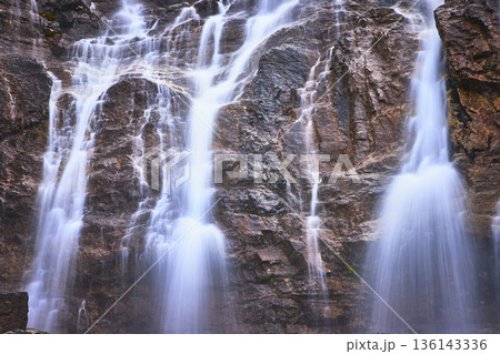 Tangle Falls Waterfall Cascading Over Rocky Cliff in Jasper Canada Tangle Falls Waterfall Cascading Over Rocky Cliff in Jasper Canada 136143336