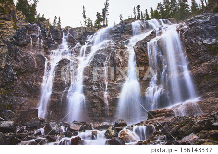 Tangle Falls Waterfall Cascading Over Rocky Cliffs with Lush Forest Jasper Canada Tangle Falls Waterfall Cascading Over Rocky Cliffs with Lush Forest Jasper Canada 136143337