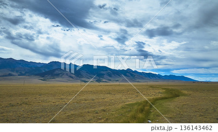 Aerial Wyoming Open Plains Mountain Range and Dramatic Sky Landscape Aerial Wyoming Open Plains Mountain Range and Dramatic Sky Landscape 136143462