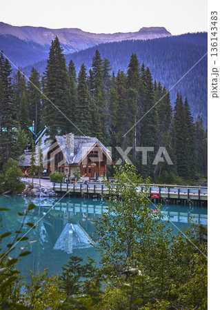 Emerald Lake Lodge at Sunrise with Bridge and Reflections in Tranquil Water 136143483