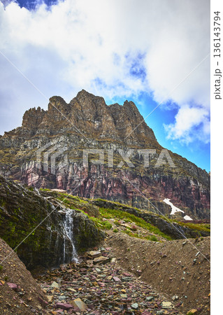 Majestic Rocky Mountain Waterfall and Alpine Scenery on Hidden Lake Trail 136143794