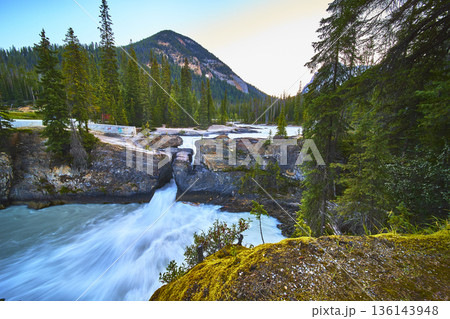 Natural Bridge Waterfall Flowing River and Forest Mountain Landscape 136143948