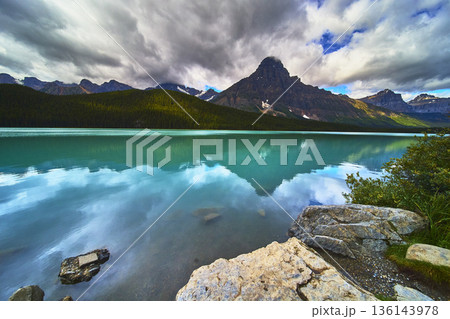 Turquoise Lake Calm Water and Majestic Mountain Reflections with Dramatic Sky Turquoise Lake Calm Water and Majestic Mountain Reflections with Dramatic Sky 136143978
