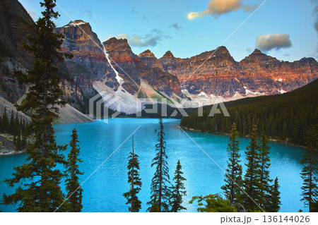 Lake Moraine Sunrise with Turquoise Water and Rocky Mountains in Banff 136144026