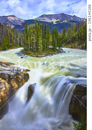 Sunwapta Falls Cascade Lush Forest and Majestic Mountain Landscape Canada 136144166