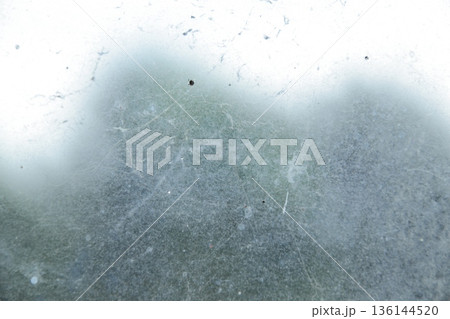 Metallic Texture Displaying Scratches and Blurred Elements under Natural Light for Abstract Industrial Backgrounds Metallic Texture Displaying Scratches and Blurred Elements under Natural Light for Abstract Industrial Backgrounds 136144520
