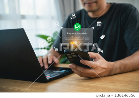 Man using smartphone for mobile payment with virtual successful transaction interface and e-commerce technology icons for secure online shopping concept 136146356