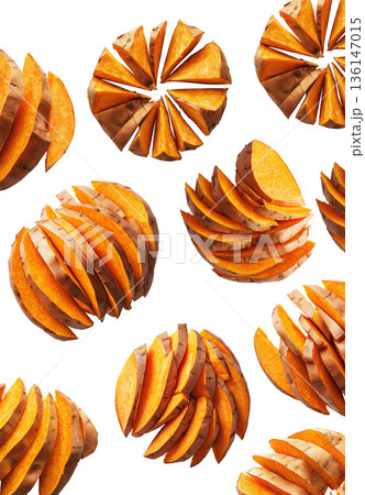 Piles of sweet potato slices placed randomly, isolated on white background, concept of healthy snack food 136147015