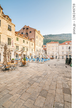 Table near the restaurants at Dubrovnik old town square. Summer morning after sunrise. Ancient town in Croatia. 136149759