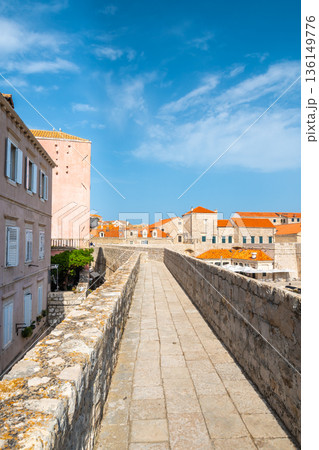 Ancient stone wall of Dubrovnik Old Town, stunning fortification system. The world famous and most visited historic city of Croatia, UNESCO World Heritage site 136149776